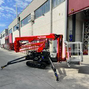 PB 18.95 8 lift being used in front of commercial warehouse
