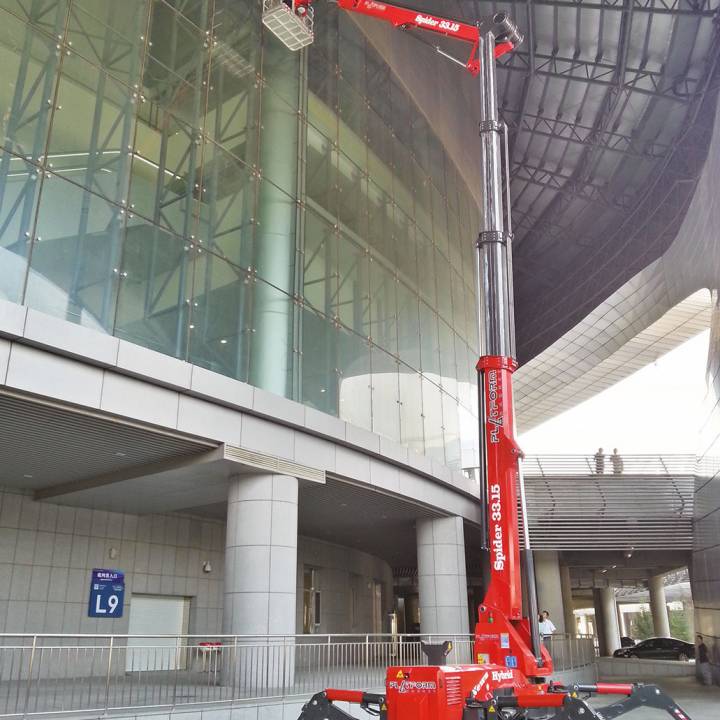 Tracked Lifts 33.15 being used on a large commercial glass building